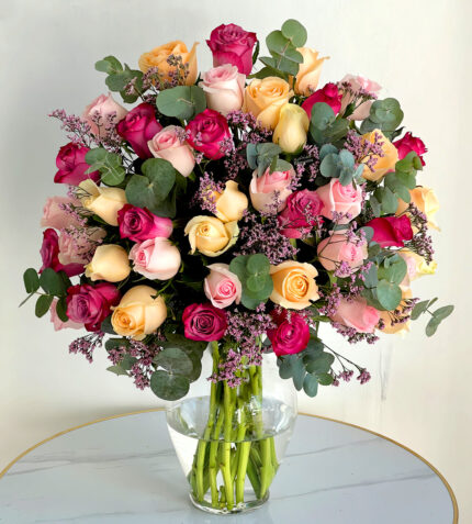 Elegant Trio of Roses Ã¢â‚¬â€œ 36 Peach, Pink & Purple Roses in Glass Vase