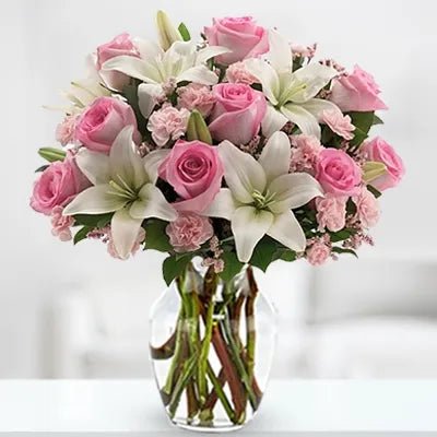 3 White Lilies 9 Pink Roses 10 Pink Carnation In a Vase