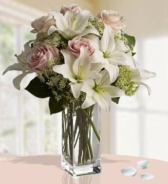 Graceful Lilies and Peach Roses In a Vase